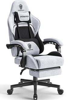 Gray ergonomic gaming chair with armrests and footrest.