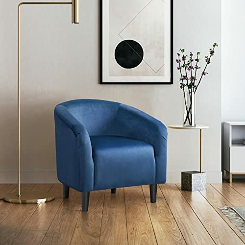 Yaheetech Club Chair in a modern living room with a floor lamp, framed art, and a small table with flowers.