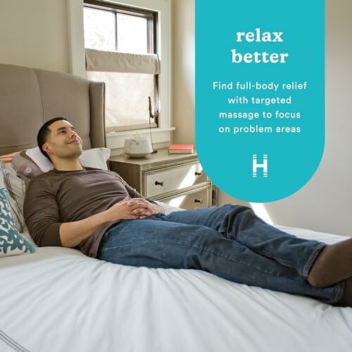 Man relaxing on bed with text promoting targeted massage for relief. The man is lying on his back and has a calm expression. He is surrounded by pillows and blankets, and there is a cup of tea on the bedside table.