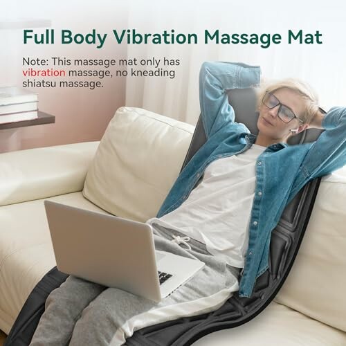 Person using full body vibration massage mat on sofa