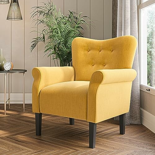 Yellow armchair in a modern living room with wooden floor and plant.